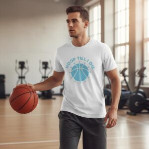 Man dribbling basketball indoors in casual sportswear.